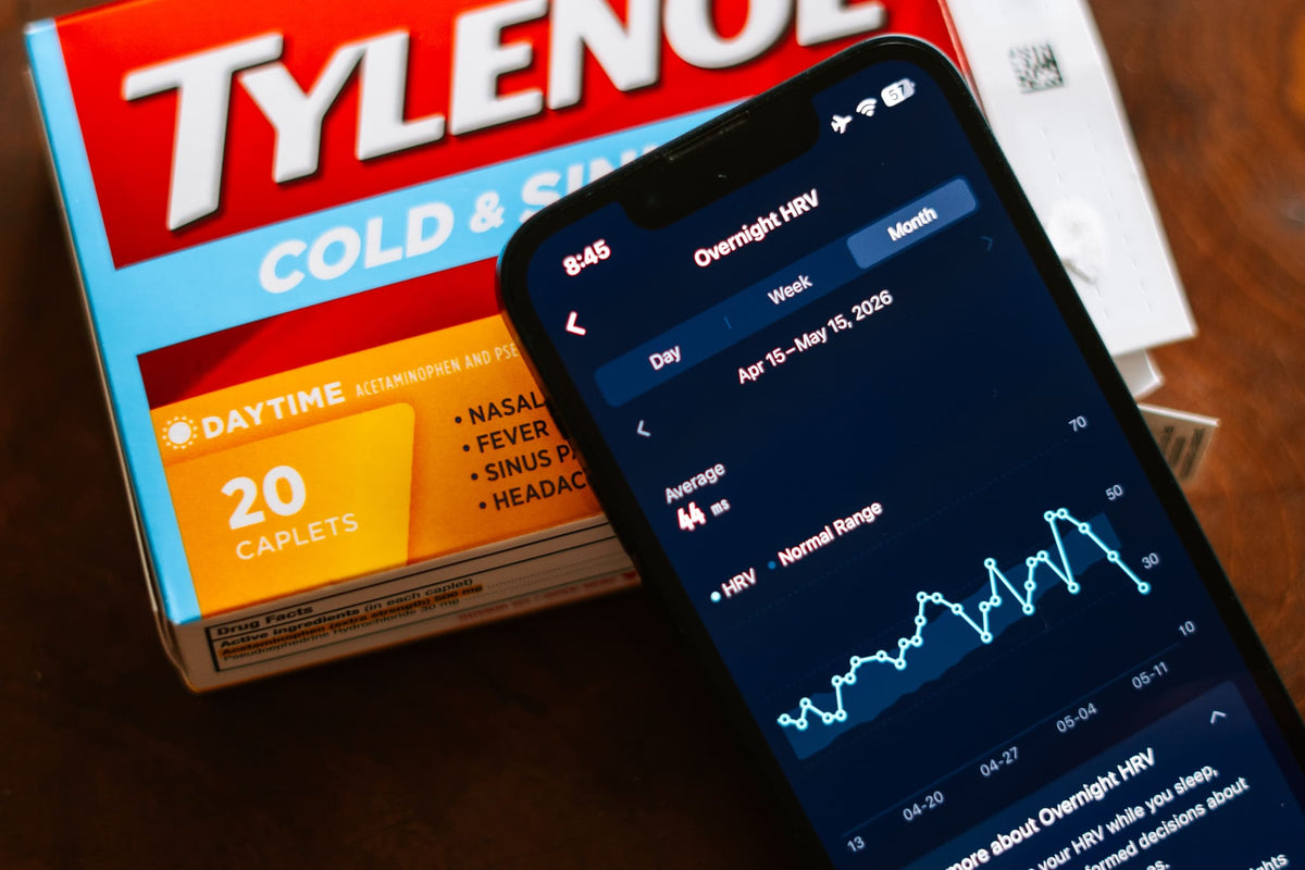 HRV trend data on a phone and a box of cold medication