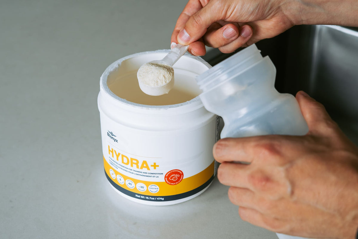 Blonyx Hydra+ being scooped into a bottle