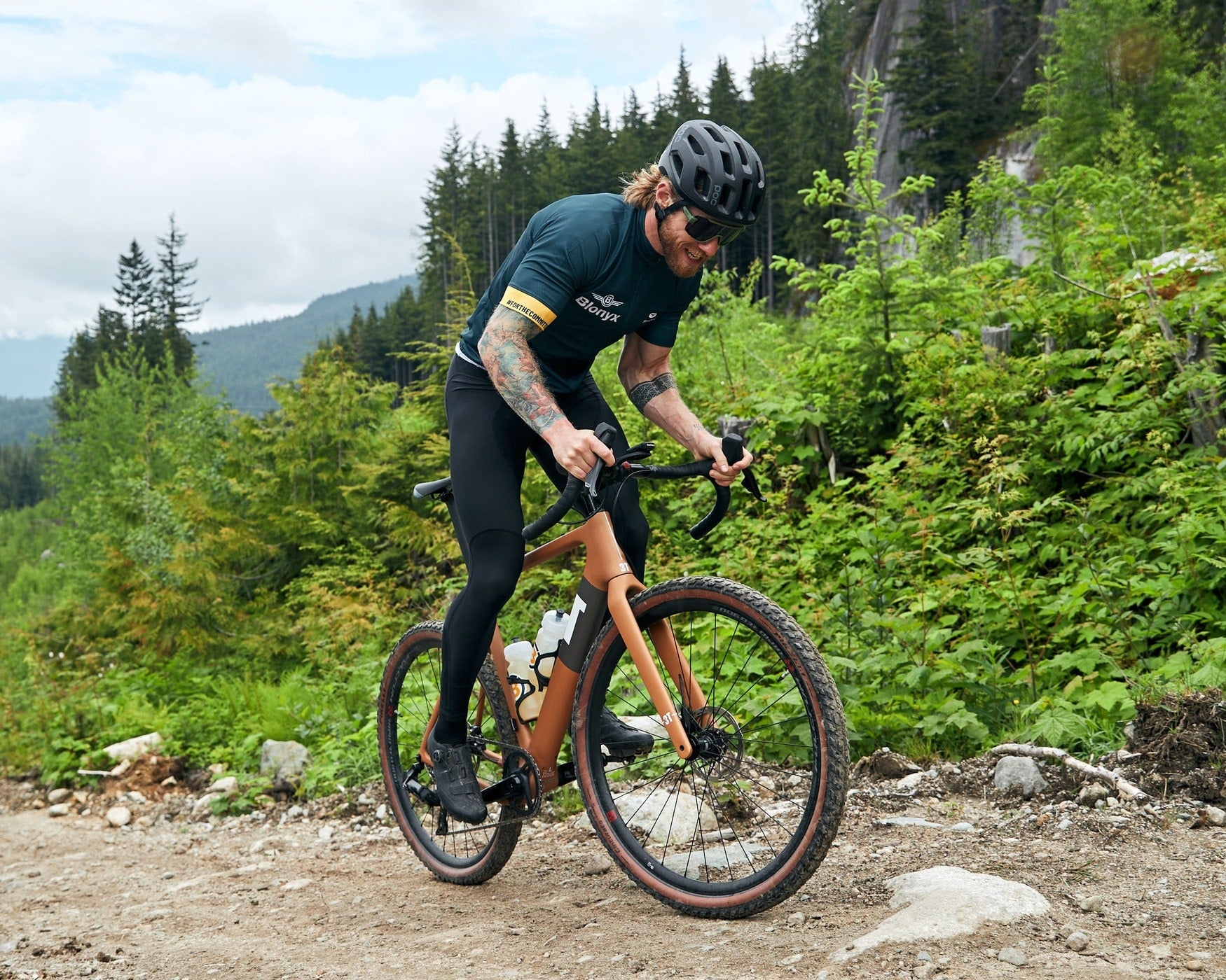 Gravel biker powering up a steep trail