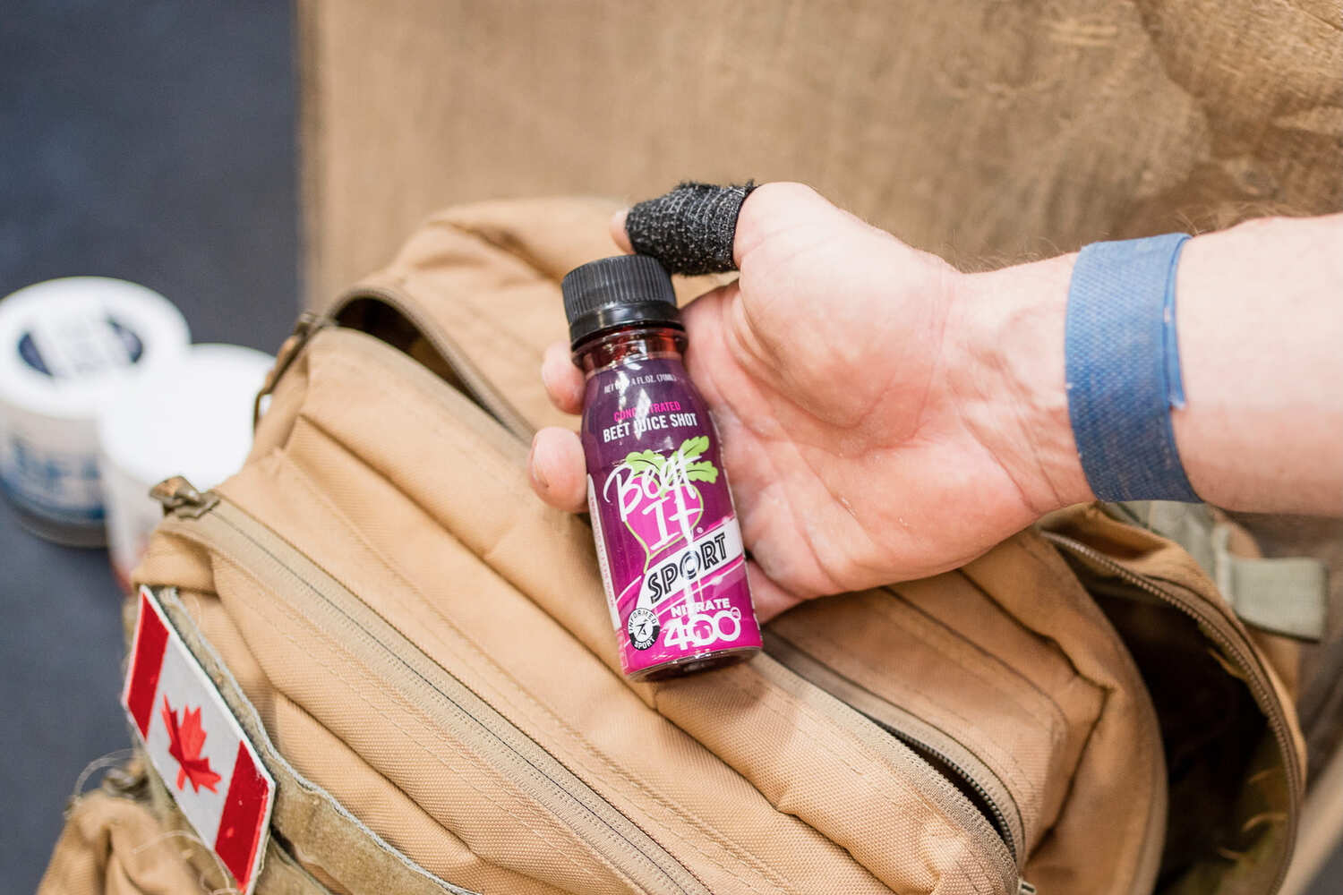 CrossFit athlete holding a Beet It Sport Nitrate 400 shot