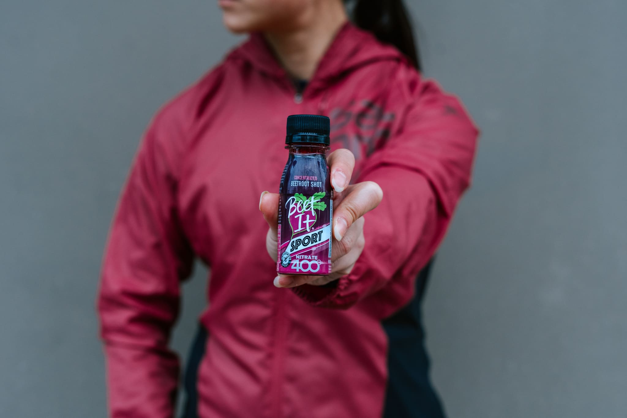 Athlete Holding a Beet It Sport Nitrate Shot