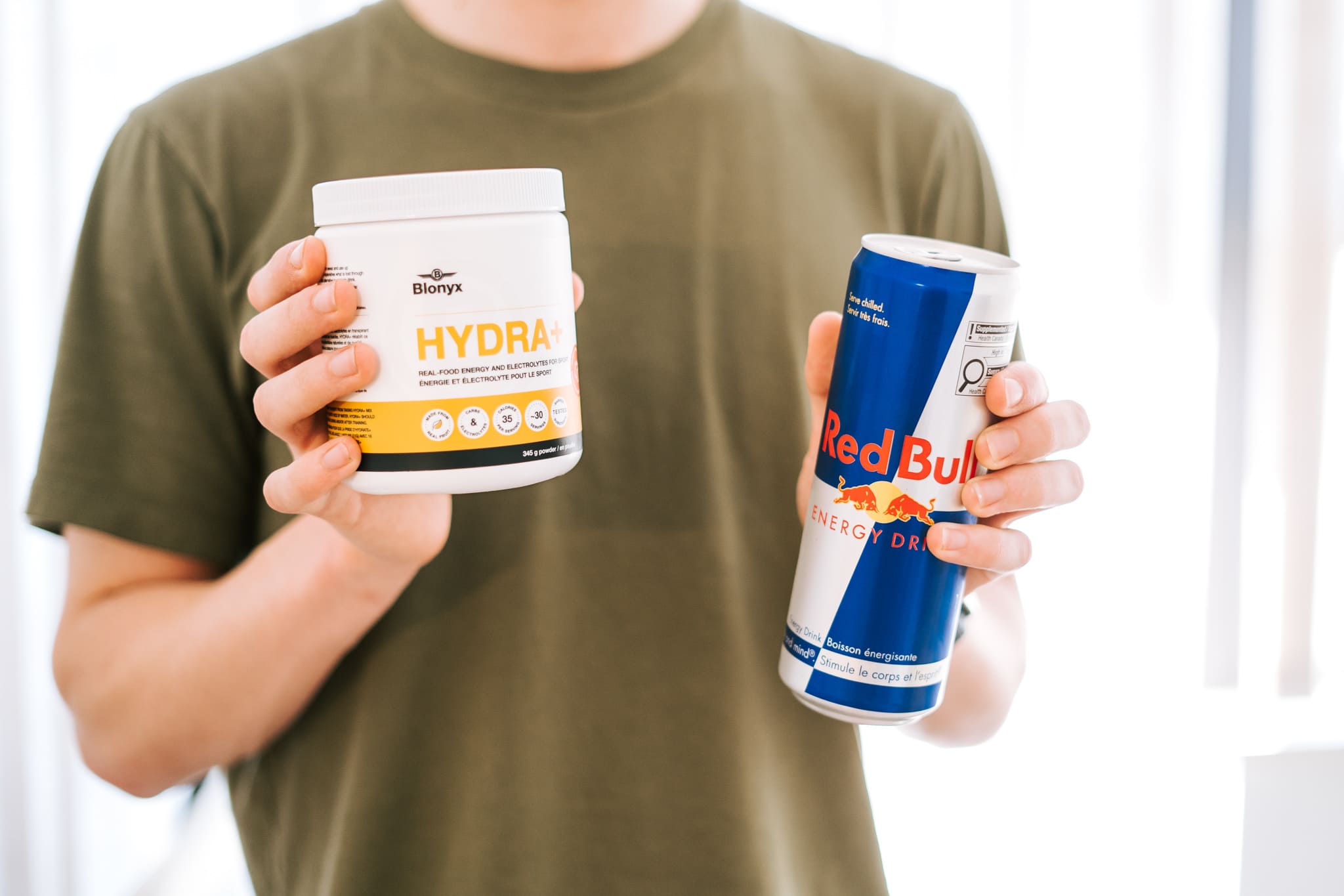 Blonyx Hydra+ and a Sports Energy Drink being Held Together