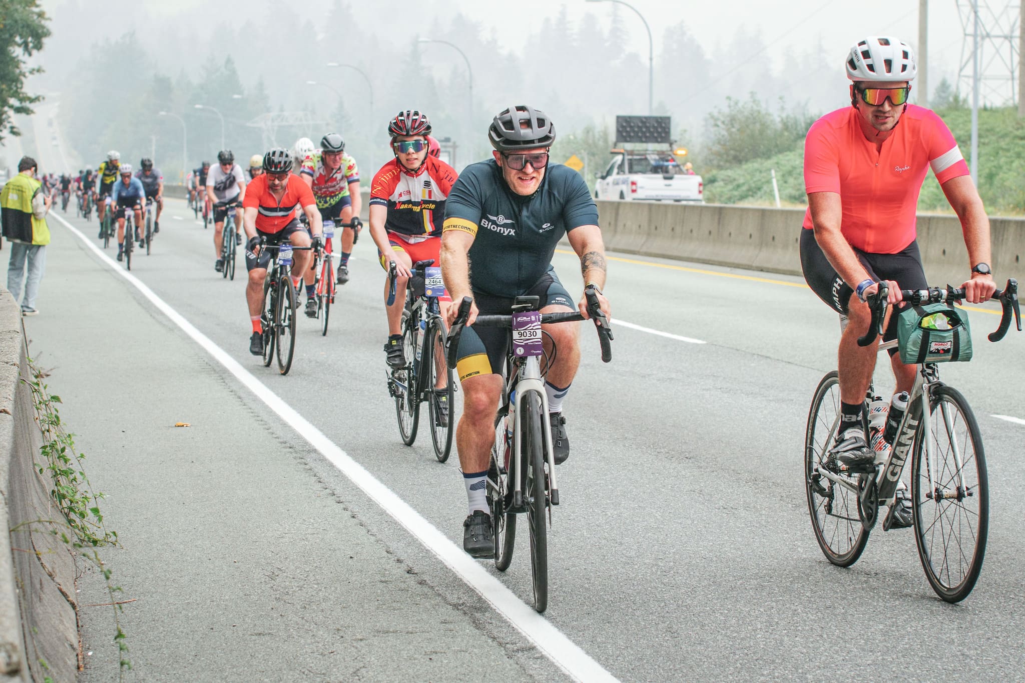 A Blonyx Cyclist rides with a group during a Fondo