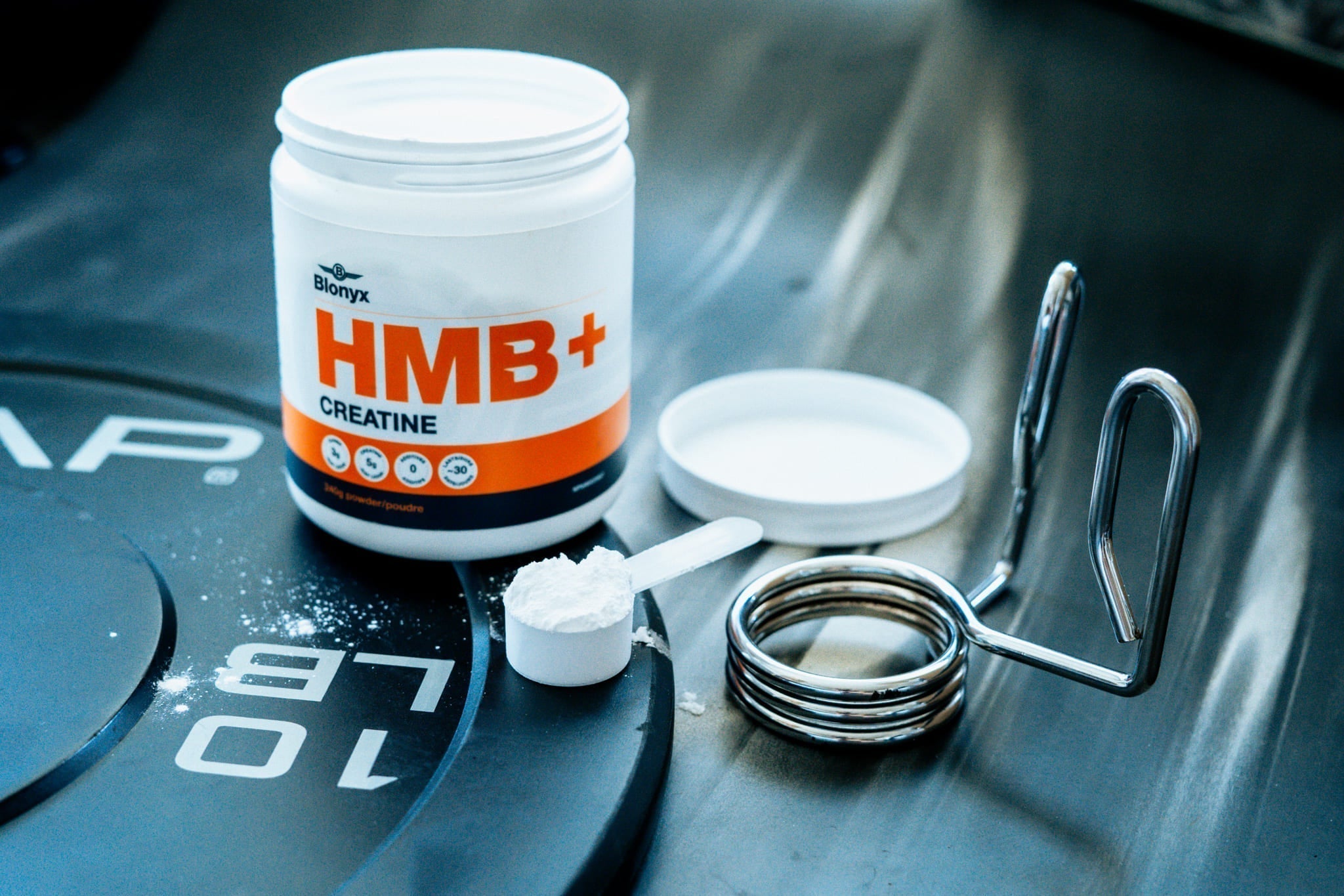 Blonyx HMB+ Creatine on a Weight Plate
