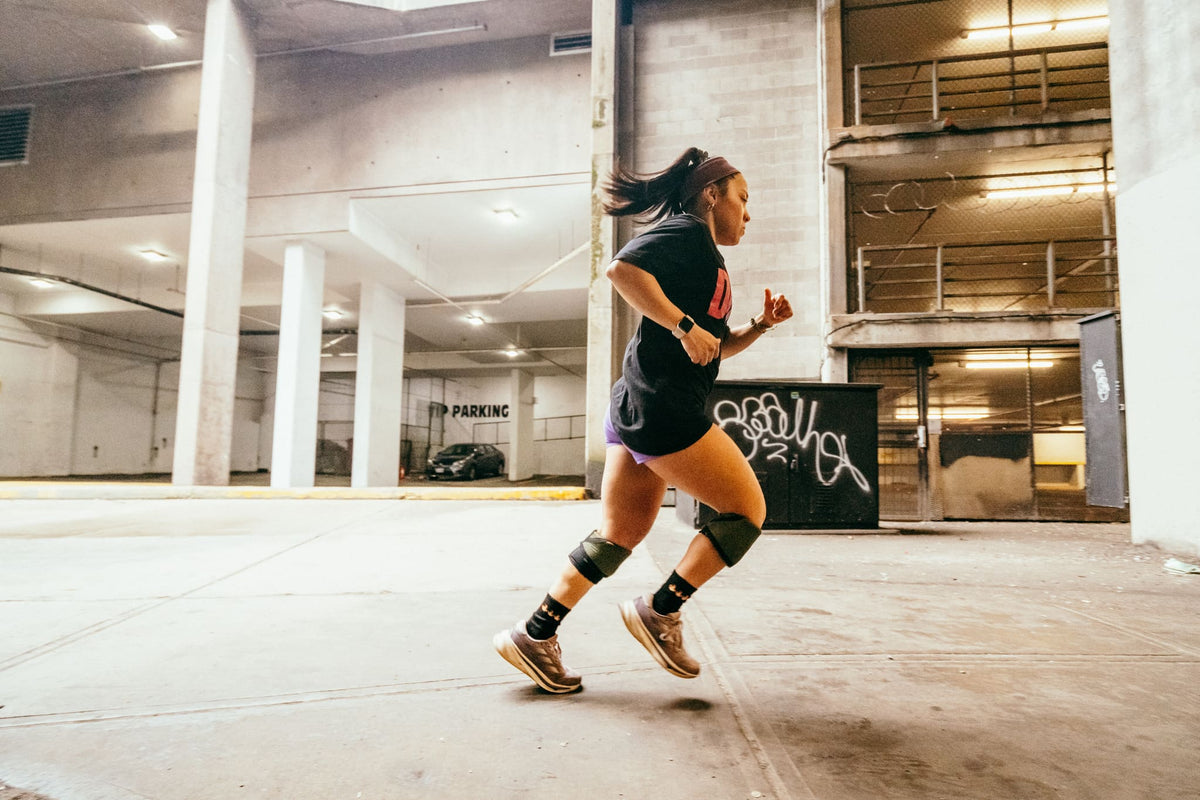 Woman running in a city