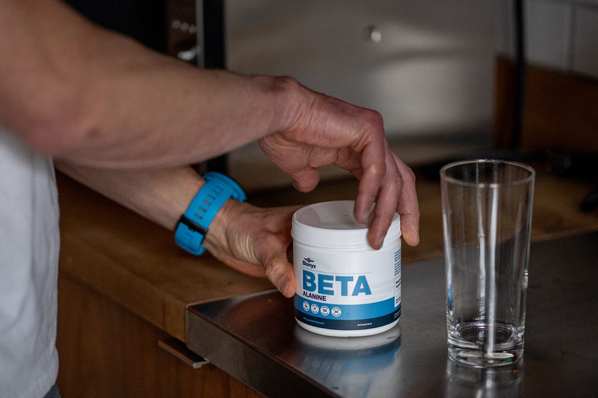 Someone Opening a Tub of Blonyx Beta Alanine