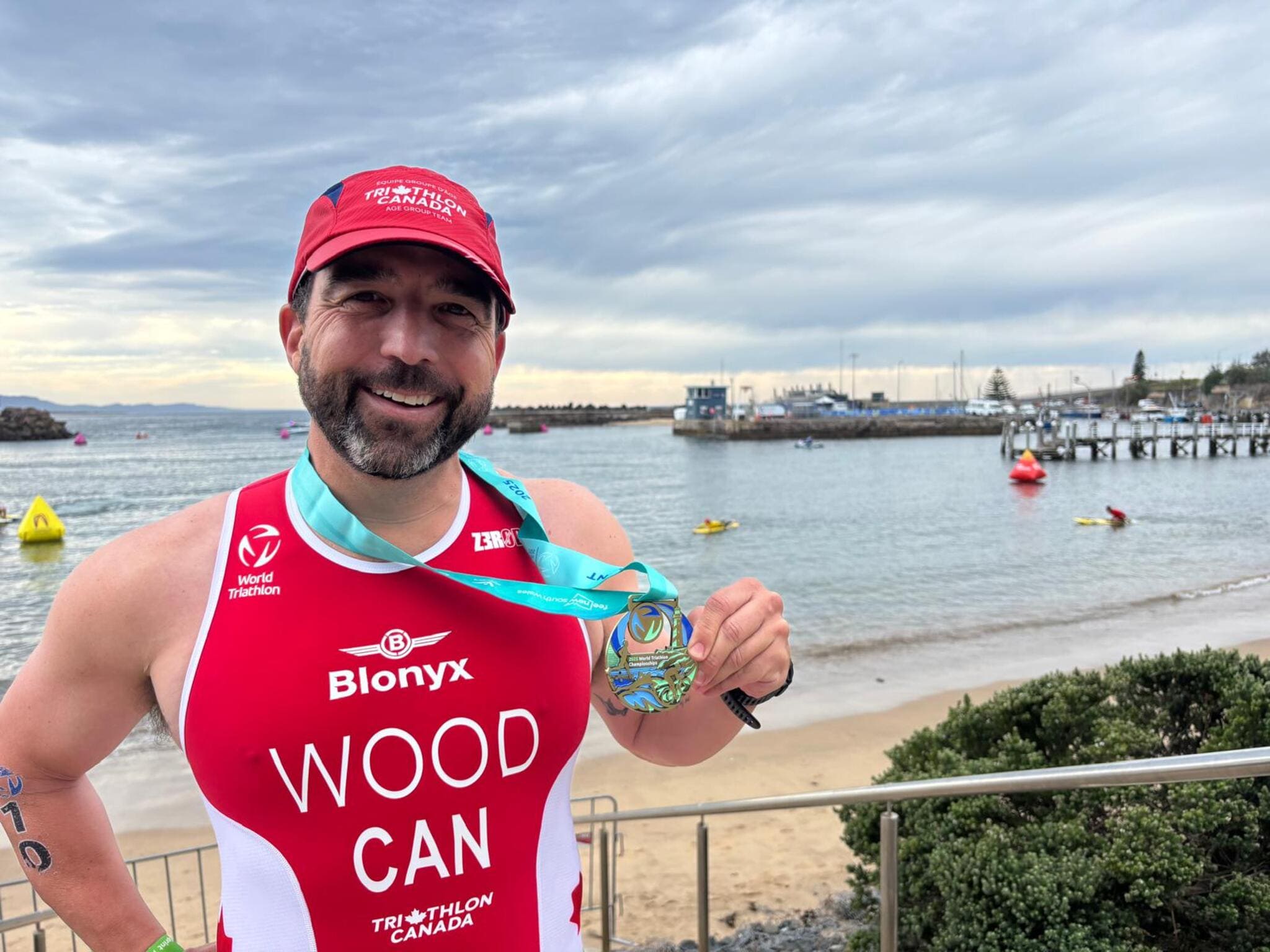 Graham Wood with a Medal after a Triathlon