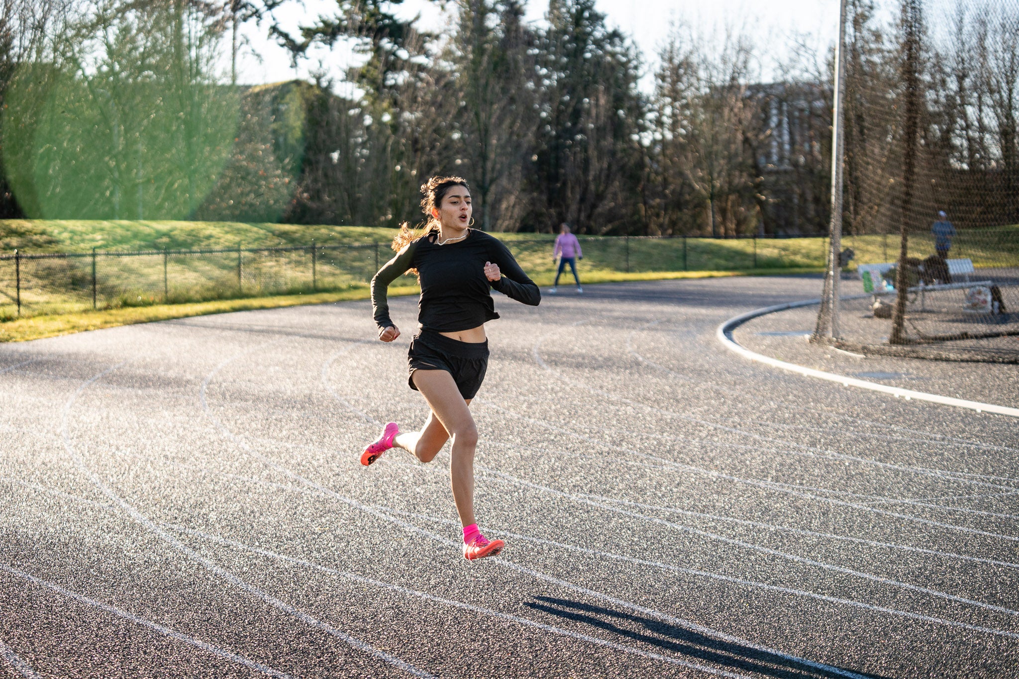 Woman running and sprinting on a track