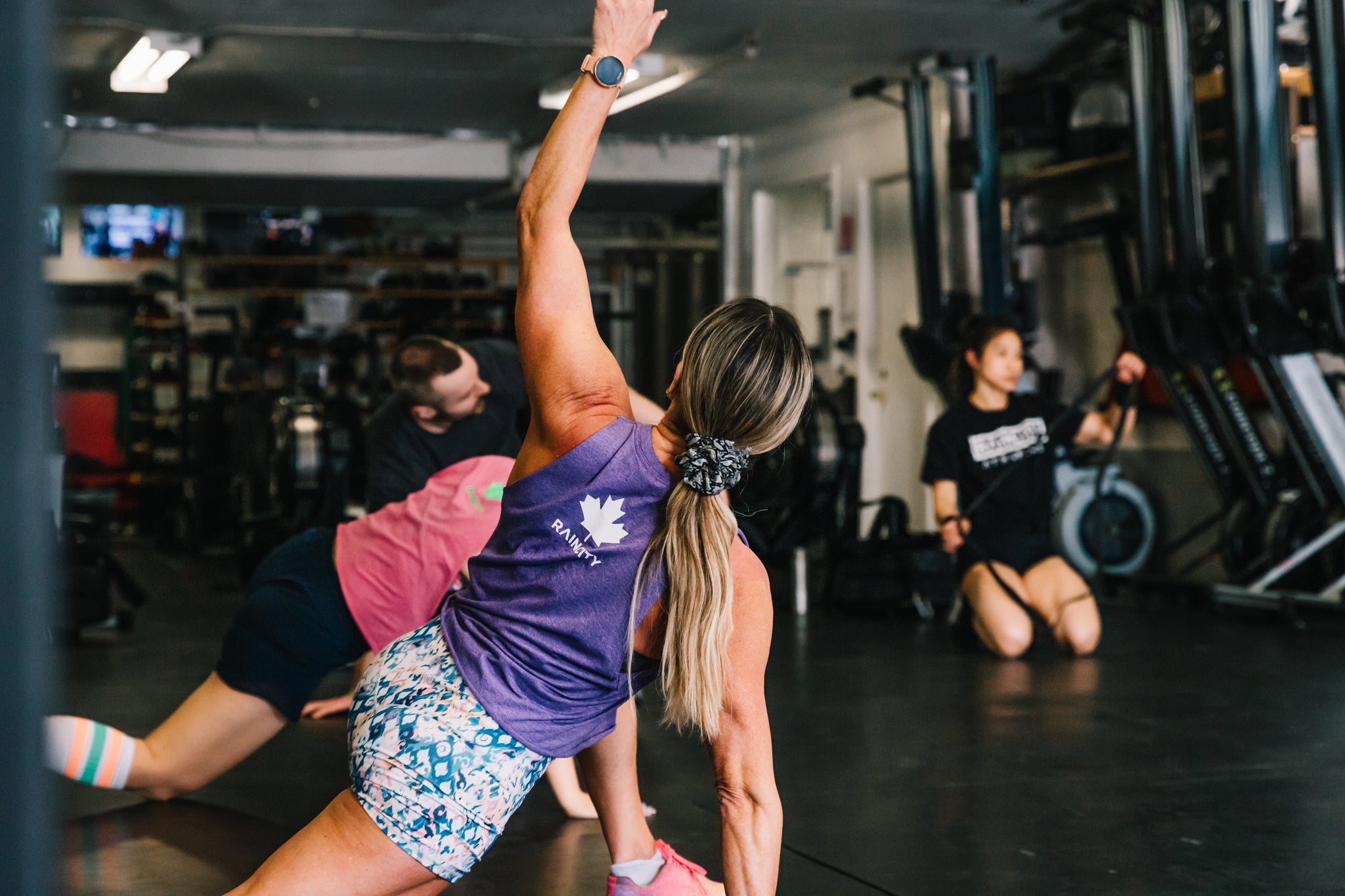 Woman stretching in a CrossFit gym