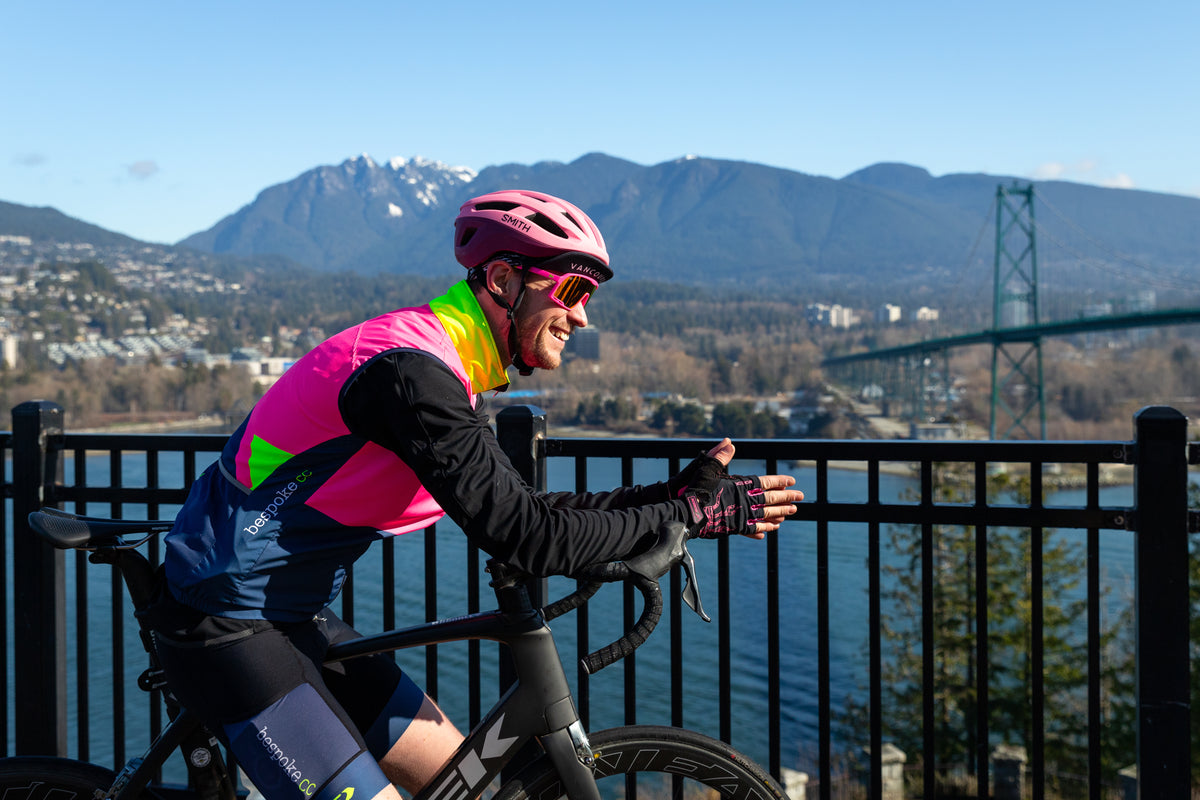 Cyclist looking out over the Lions Gate Bridge in Vancouver