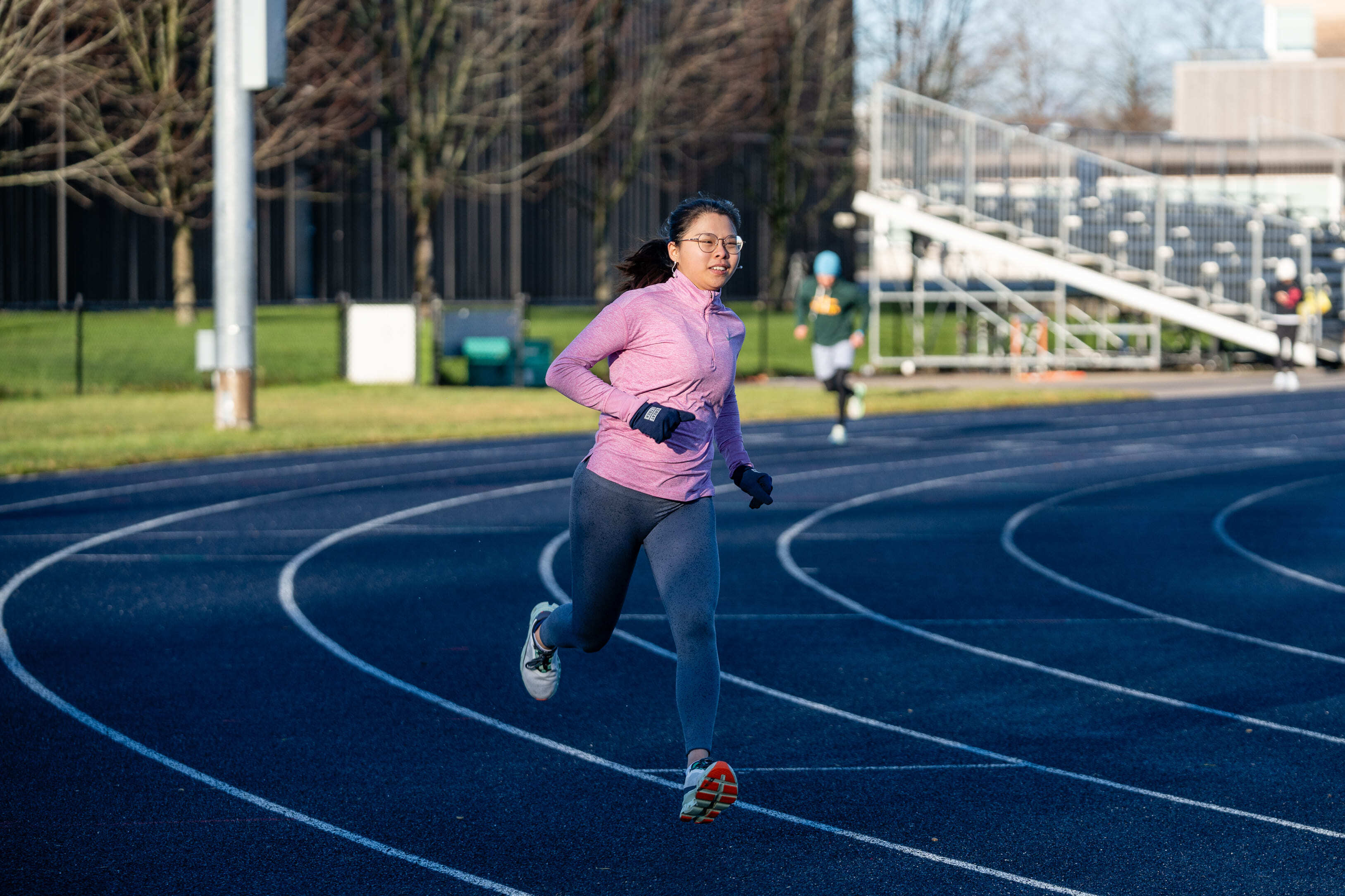 Female runner sprinting on a track