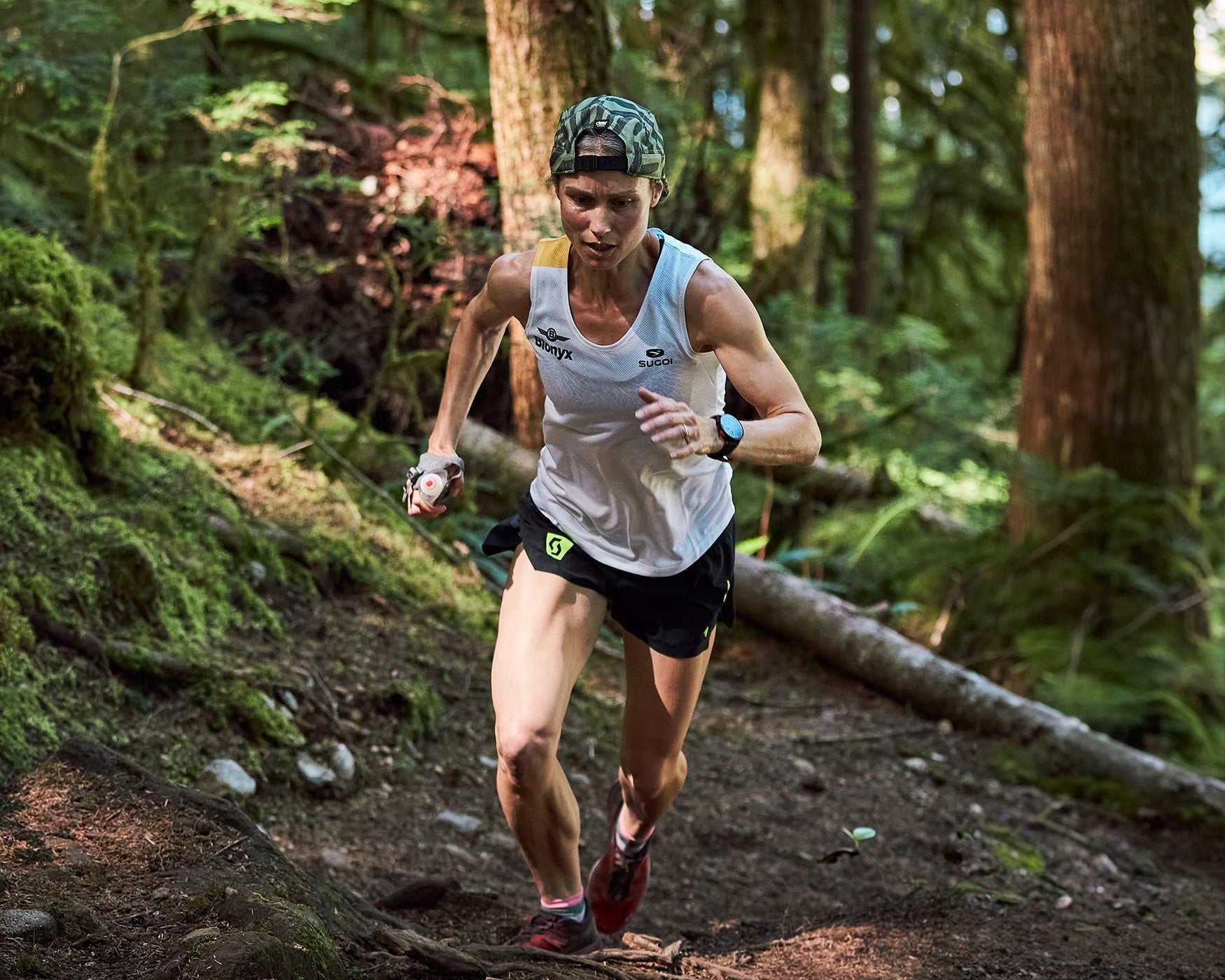 Trail runner climbing a steep trail