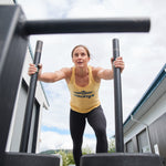 Hybrid athlete pushing a weighted sled