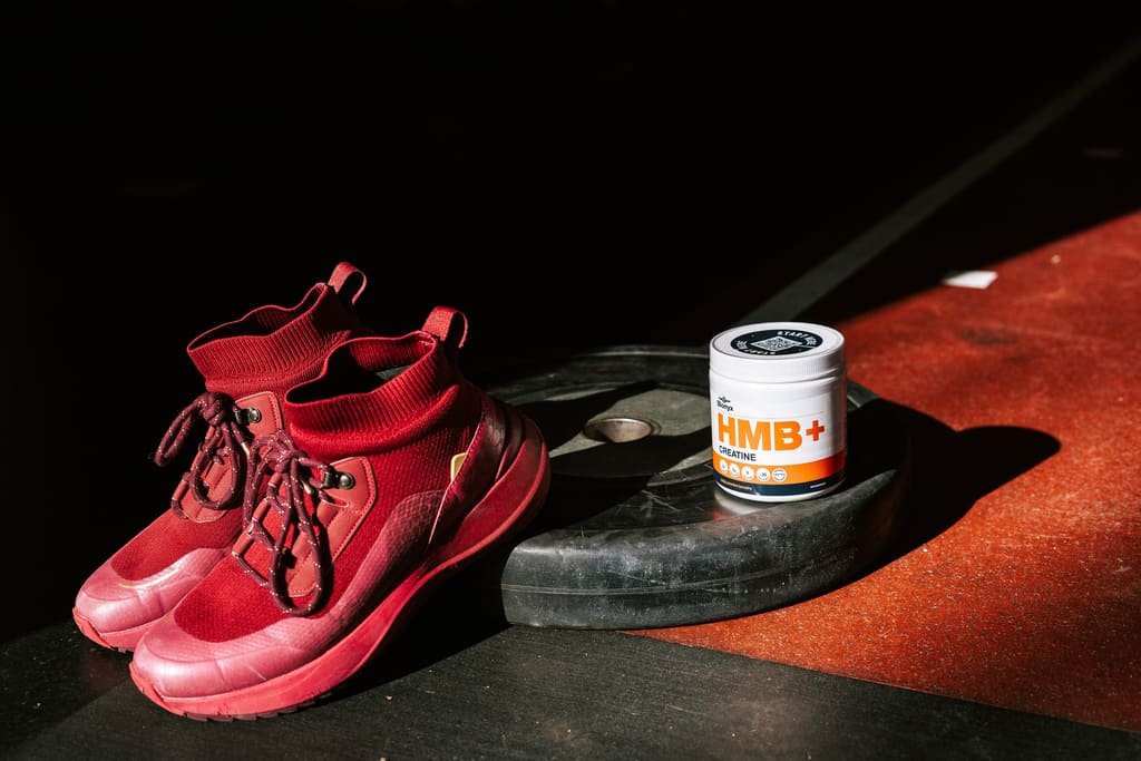 Blonyx HMB+ Creatine on a Weightplate with Weightlifting Shoes