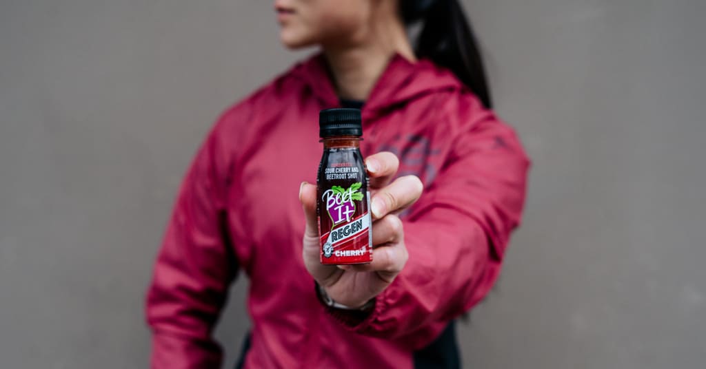Athlete Holding Beet It Sport Nitrate 400 