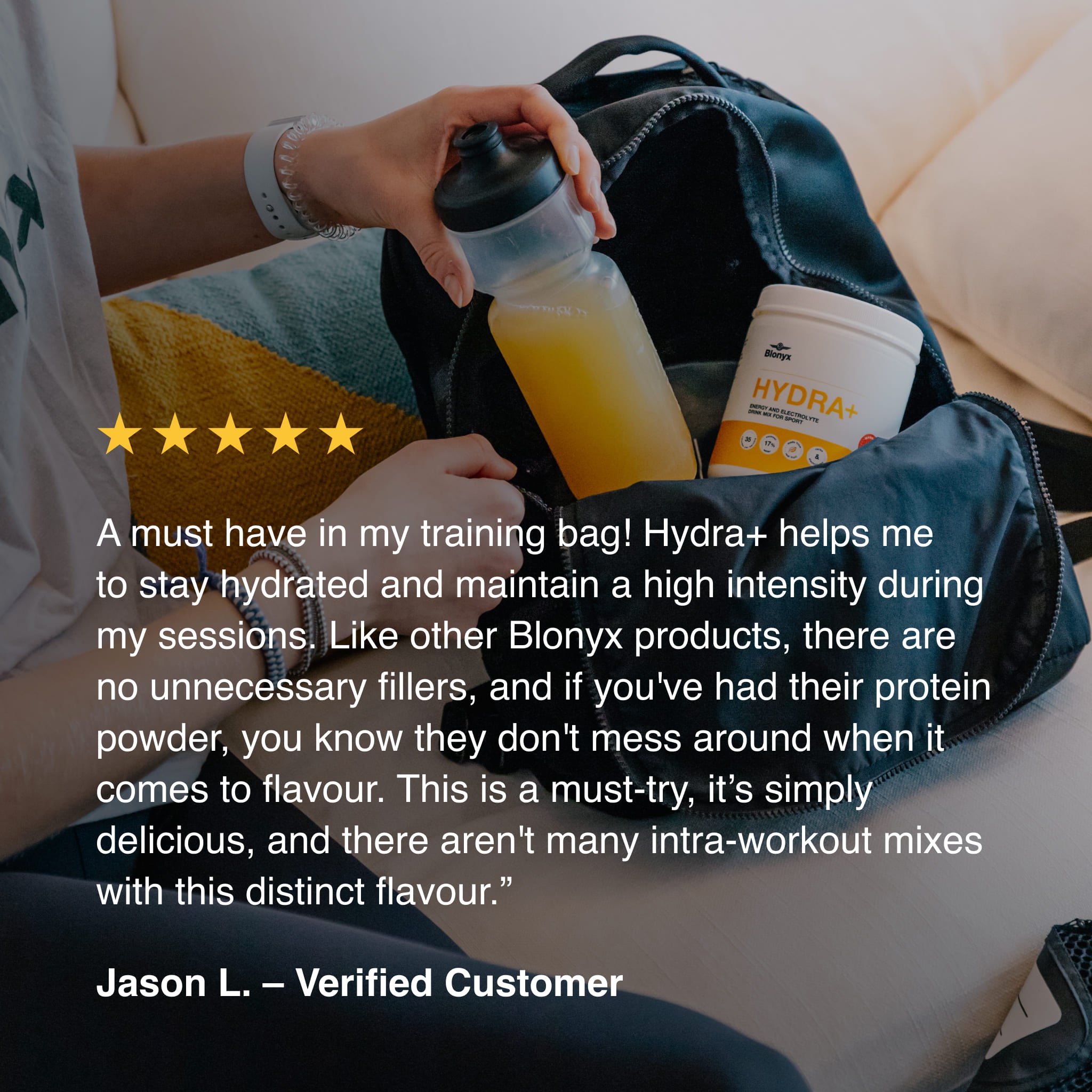Blonyx Hydra+ energy and electrolyte drink mix beside a cycling water bottle in a training bag, showcasing real-food sports hydration, electrolytes, carbohydrates, and athletic performance support.