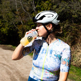 Cyclist drinking Blonyx Hydra+ out of a Blonyx water bottle