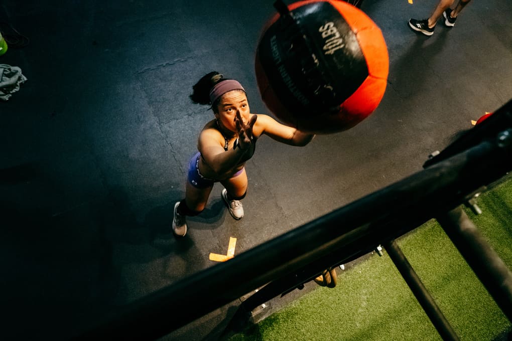 A Hyrox Athlete Performs Wallballs
