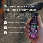 Hand holding Beet It Sport Nitrate 400 beetroot shot with text describing dietary nitrate benefits for endurance performance, nitric oxide production, and exercise efficiency.