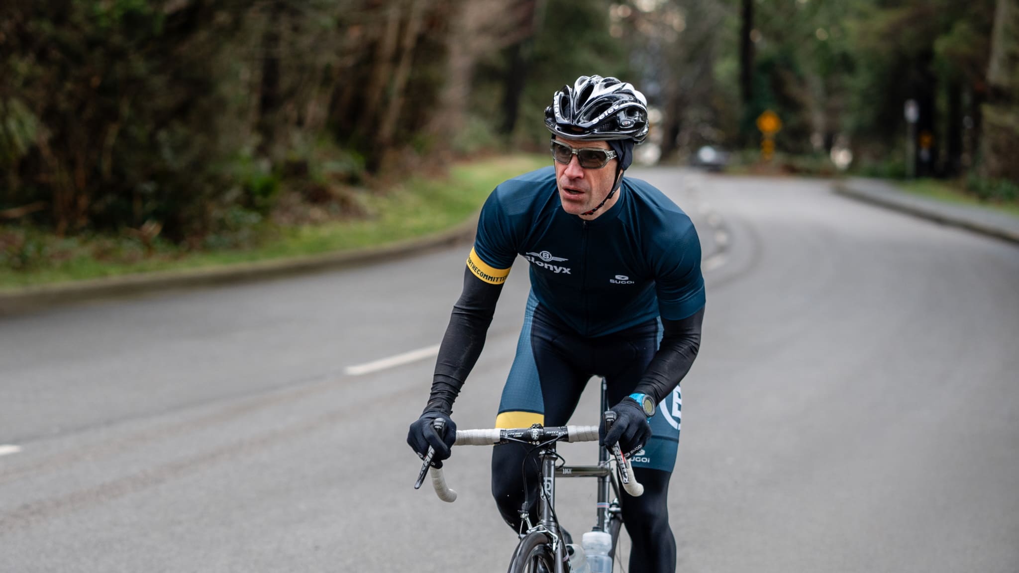 Cyclist riding through Stanley Park in Vancouver