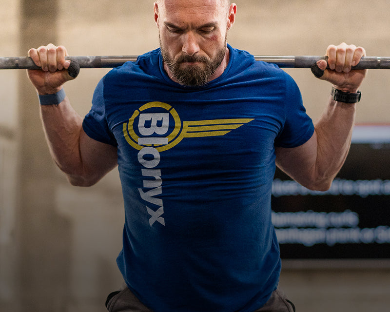 A weightlifter performing squats in a gym