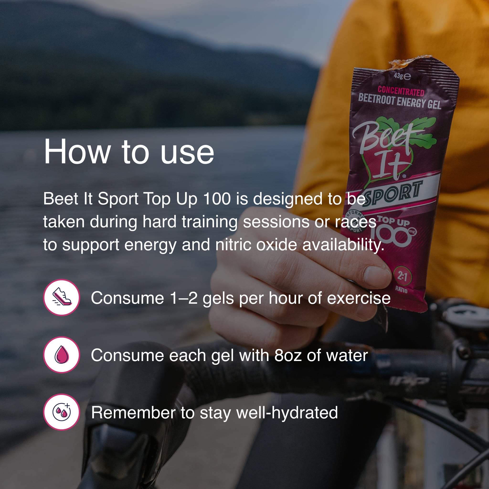 Cyclist holding Beet It Sport Top Up 100 energy gel with instructions recommending 1–2 gels per hour of exercise, water intake with each gel, and proper hydration during endurance training.